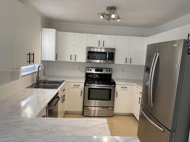 kitchen featuring ornamental molding, stainless steel appliances, sink, white cabinetry, and light tile patterned flooring