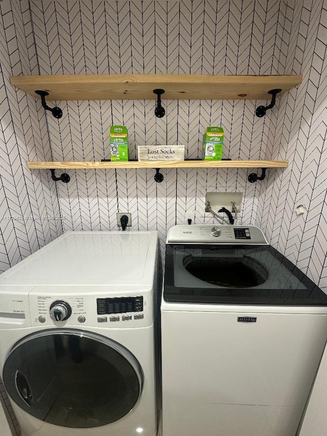 laundry room featuring washing machine and dryer