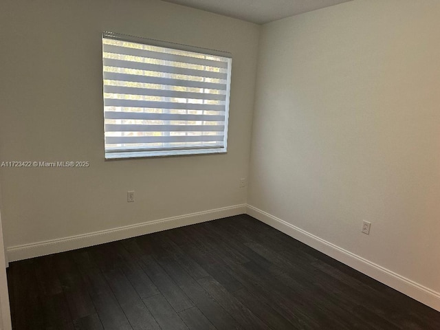 empty room featuring dark hardwood / wood-style floors