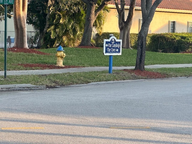 view of home's community with a yard