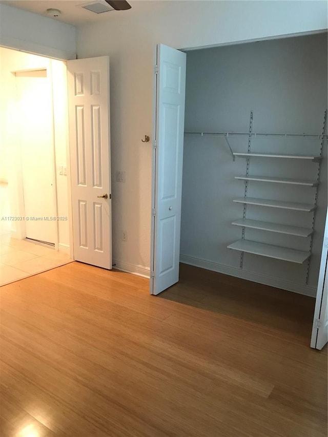 unfurnished bedroom featuring wood-type flooring