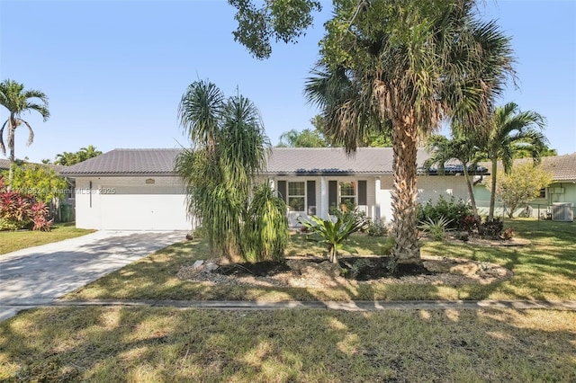 view of front of property featuring a garage and a front lawn