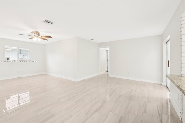 unfurnished room featuring ceiling fan