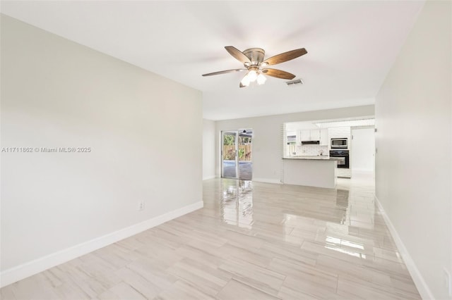 unfurnished room featuring ceiling fan