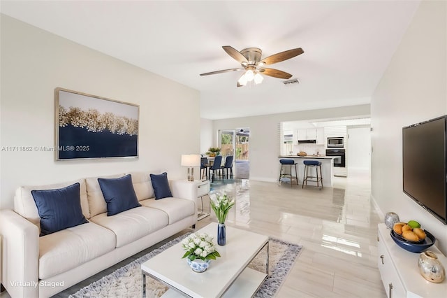 living room with ceiling fan