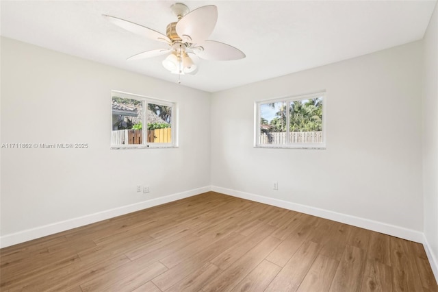 unfurnished room with ceiling fan and light hardwood / wood-style floors