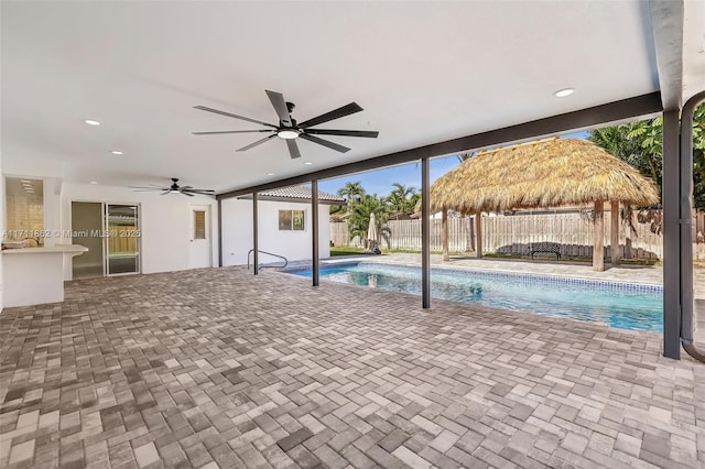 view of swimming pool with a gazebo, a patio area, and ceiling fan