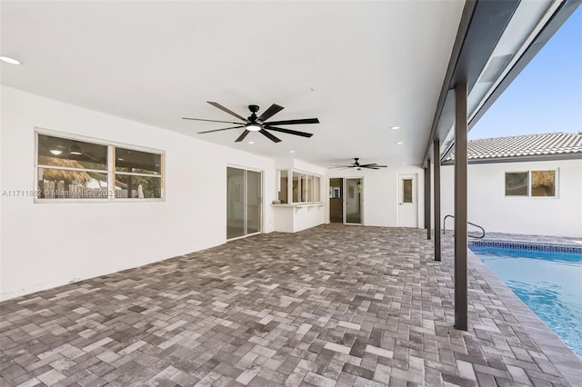 exterior space featuring ceiling fan