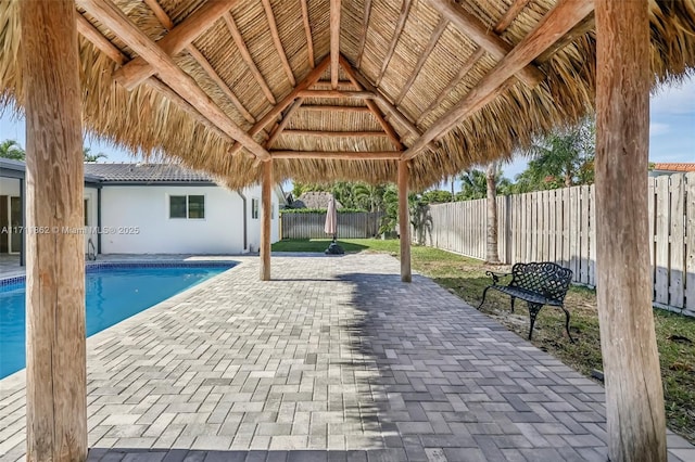 view of pool with a gazebo and a patio area