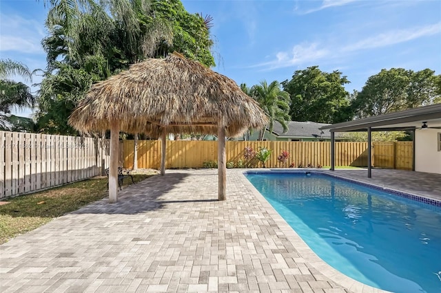 view of swimming pool featuring a gazebo and a patio