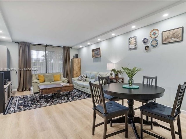 dining area with light hardwood / wood-style floors