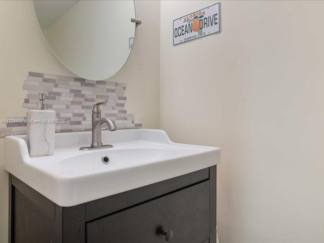 bathroom featuring decorative backsplash and vanity