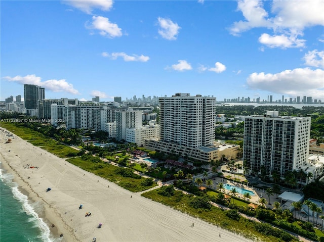 aerial view with a water view and a view of the beach