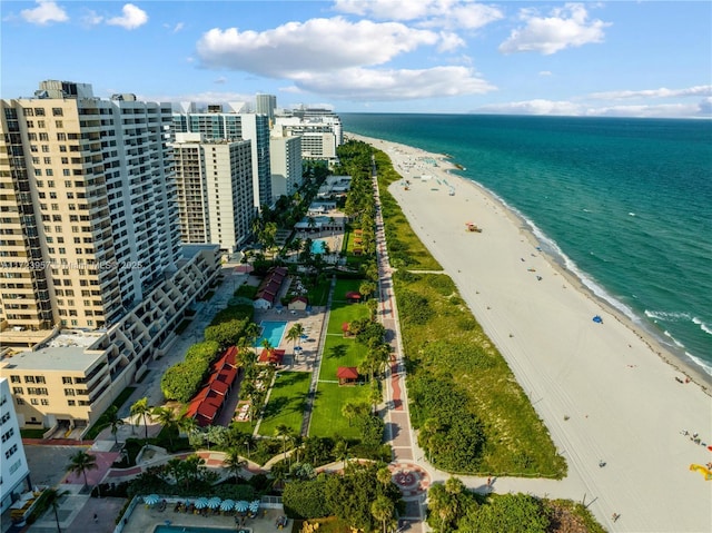 bird's eye view featuring a water view and a view of the beach