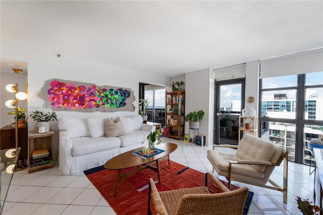 living room featuring a textured ceiling and light tile patterned flooring