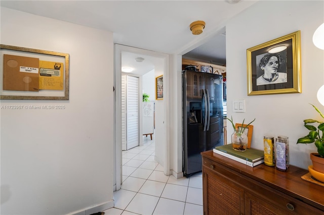 hallway featuring light tile patterned floors