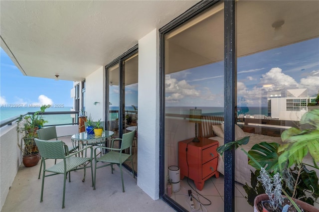 balcony featuring a water view