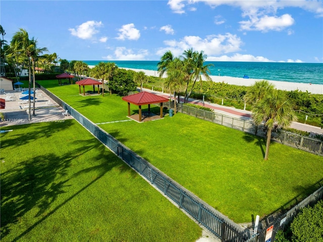 exterior space featuring a water view and a view of the beach