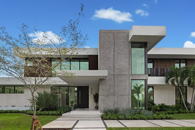 back of house featuring a yard and a patio area