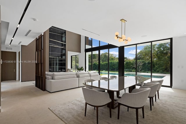 dining area with an inviting chandelier, visible vents, and floor to ceiling windows