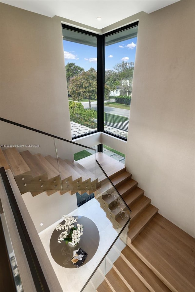 stairway featuring wood finished floors