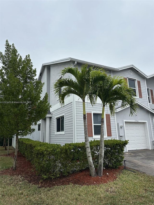 view of front of property with a garage and driveway