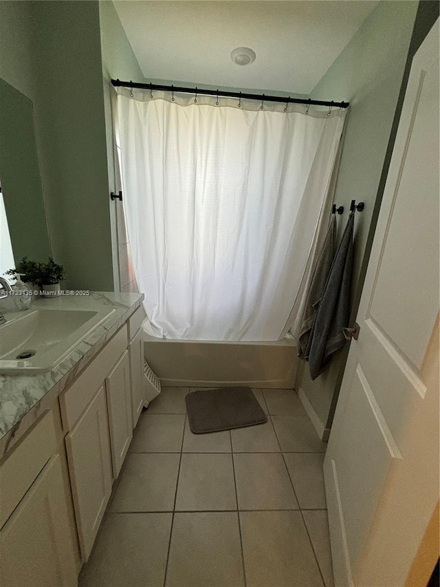 full bathroom with shower / bathtub combination with curtain, vanity, and tile patterned floors