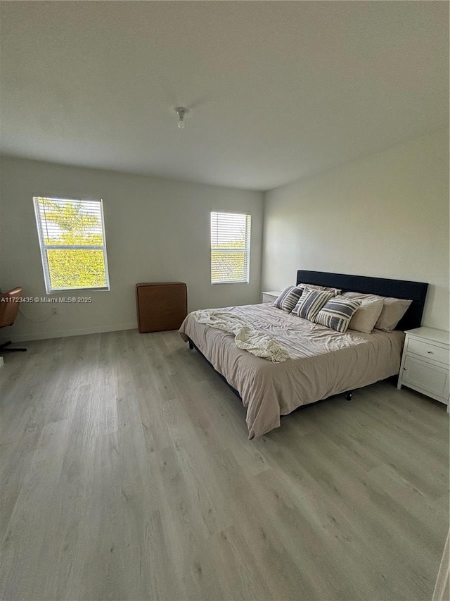 bedroom featuring light wood-style flooring