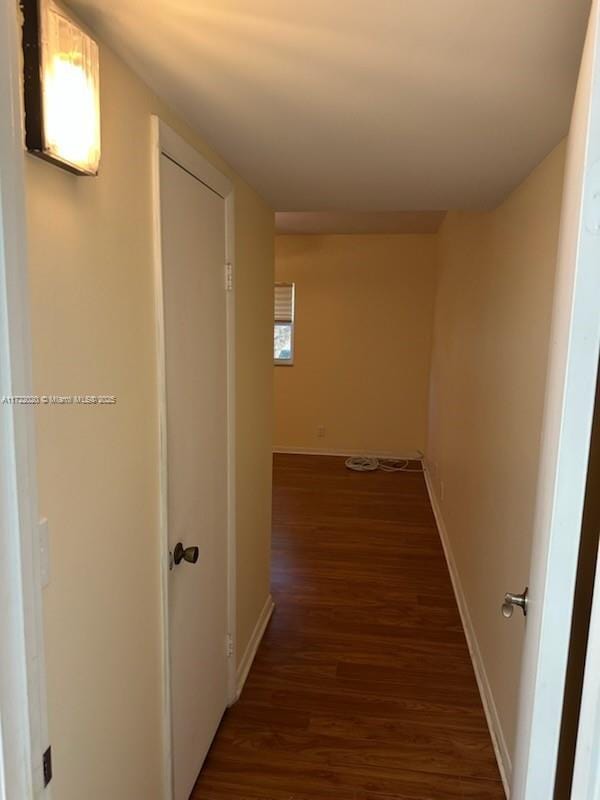 hall featuring dark wood-type flooring