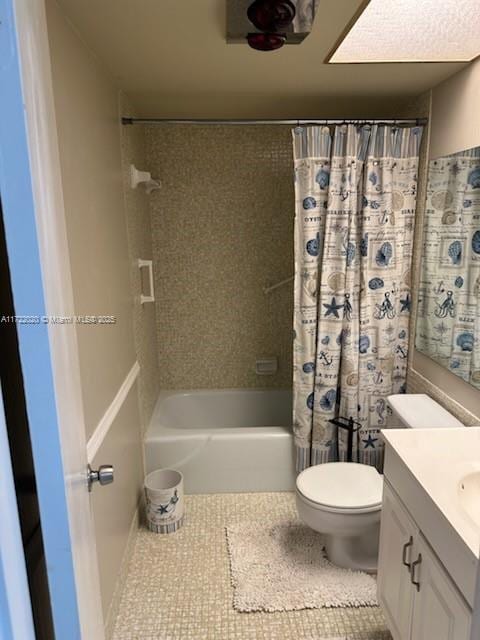 full bathroom featuring tile patterned flooring, shower / tub combo, vanity, and toilet