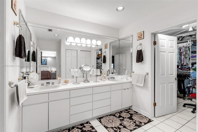 bathroom with tile patterned floors and vanity