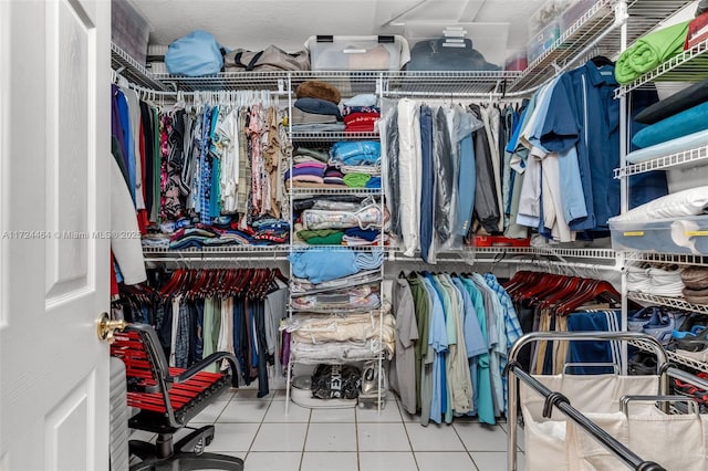 spacious closet featuring tile patterned floors