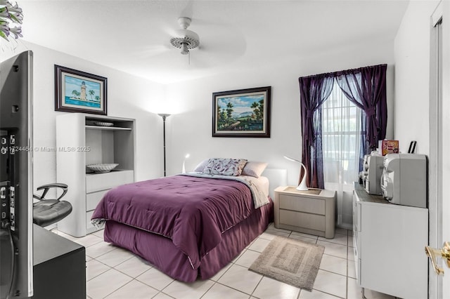 bedroom featuring ceiling fan and light tile patterned flooring