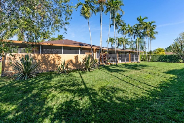 view of yard featuring a sunroom