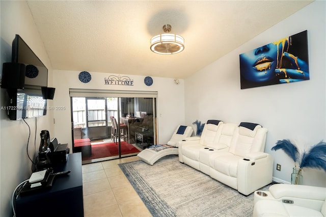 tiled living room featuring a textured ceiling