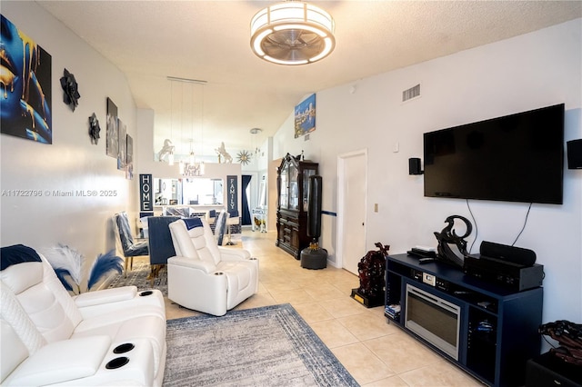 tiled living room with lofted ceiling and a textured ceiling