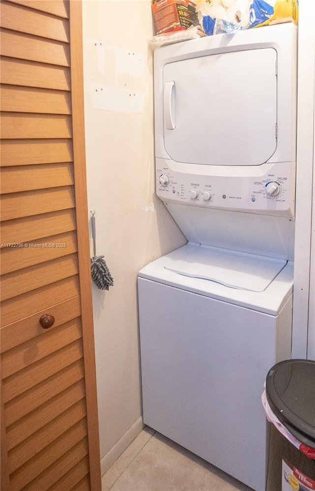 washroom with stacked washer and dryer