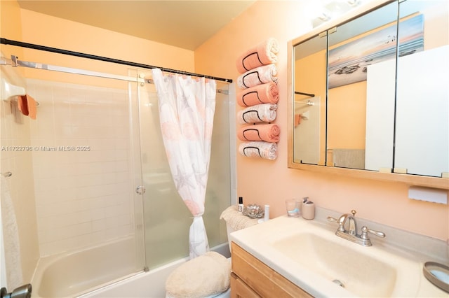 full bathroom with shower / bath combo, vanity, and toilet