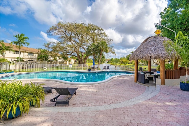 view of swimming pool featuring a gazebo and a patio