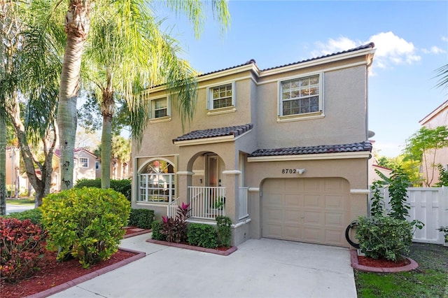 mediterranean / spanish-style home with a garage