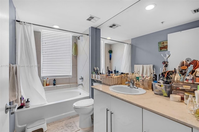 full bathroom with toilet, vanity, and shower / tub combo with curtain