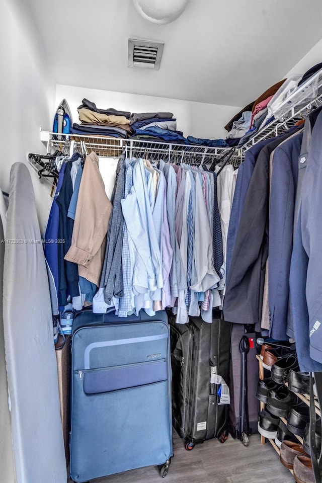 spacious closet featuring hardwood / wood-style floors