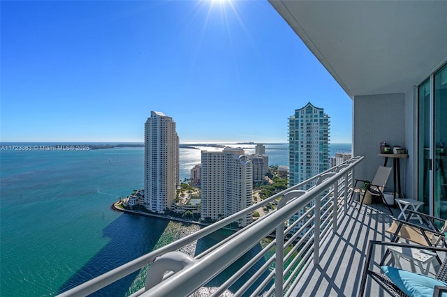 balcony featuring a water view