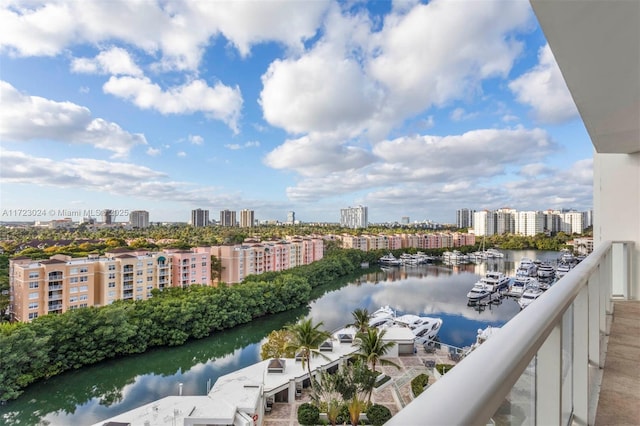 exterior space with a city view and a water view