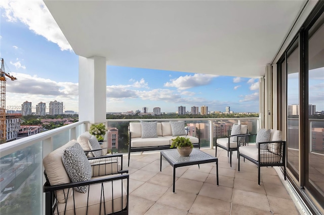 balcony with outdoor lounge area and a view of city