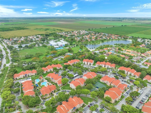 aerial view with a rural view and a water view