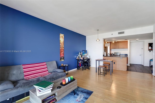 living room with light hardwood / wood-style floors