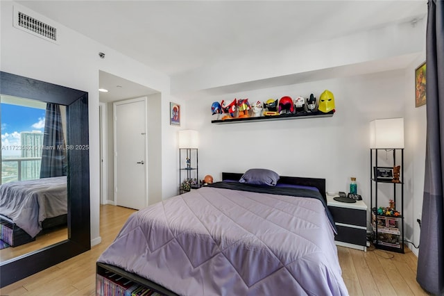 bedroom with light hardwood / wood-style flooring