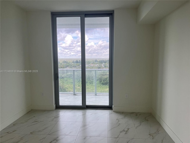 spare room featuring expansive windows