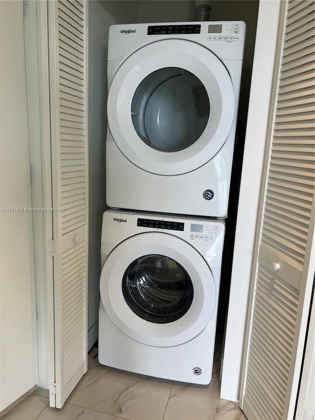 laundry room featuring stacked washing maching and dryer